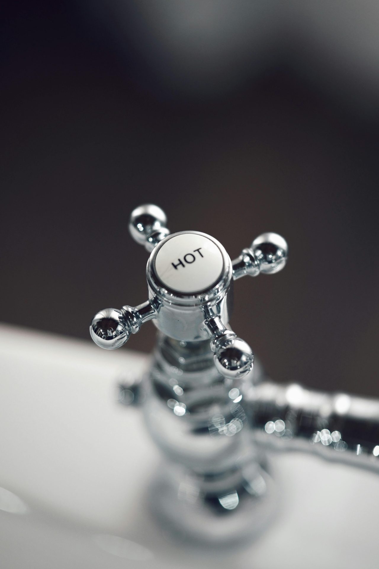 Chrome hot water tap on a basin